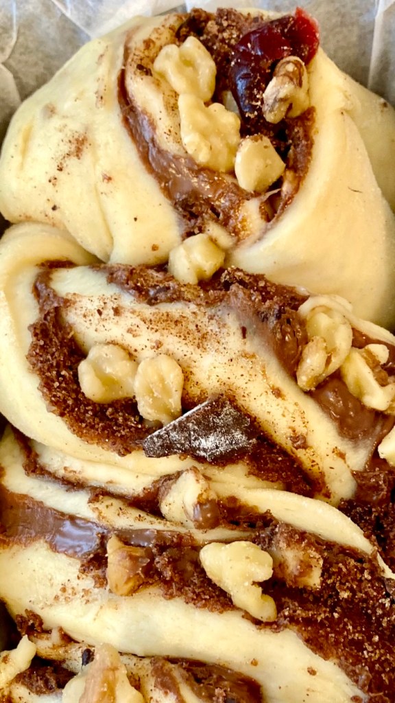 Babka log sliced lengthwise showing chocolate layers