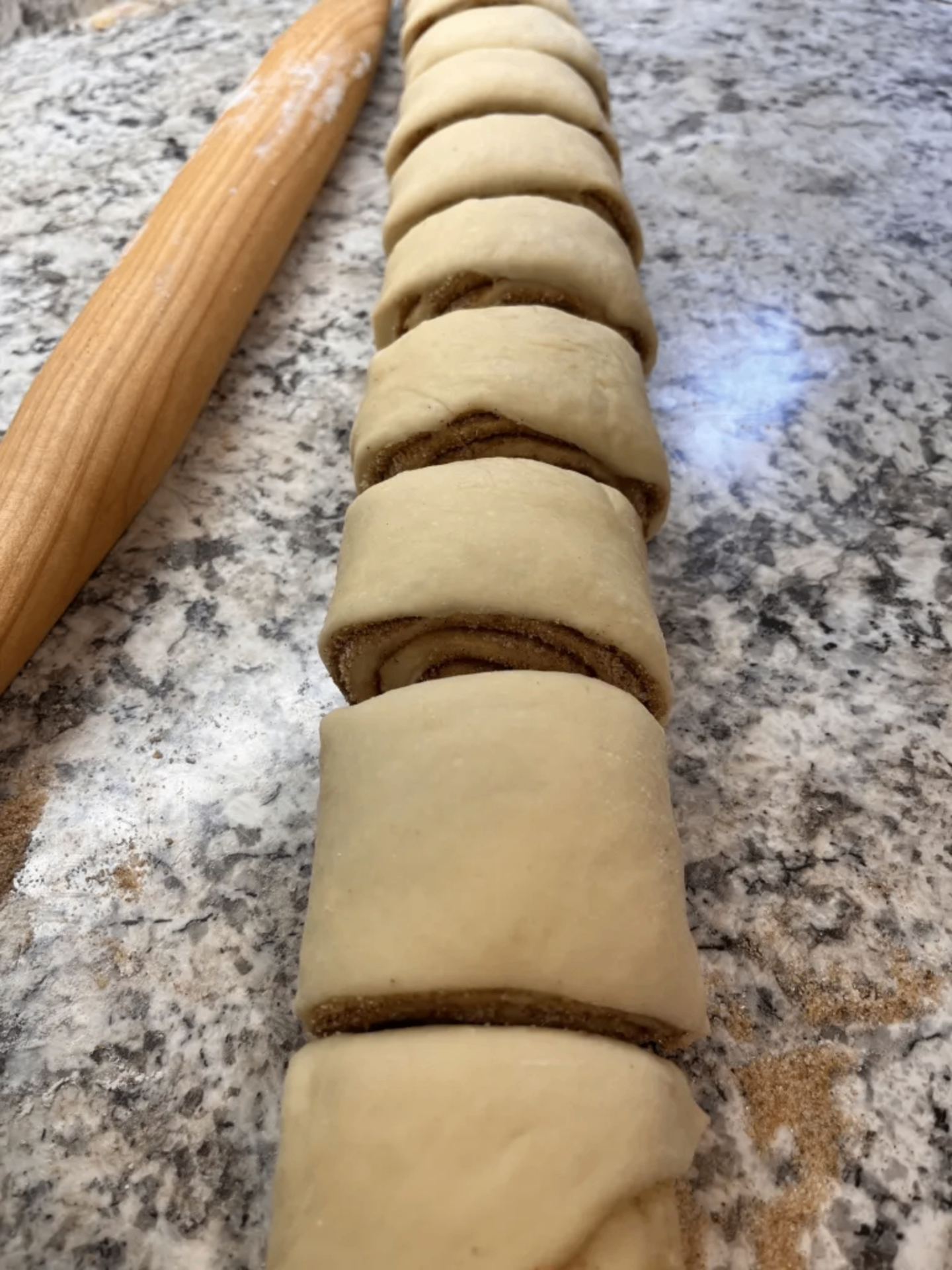 Sliced cinnamon rolls ready for the pan