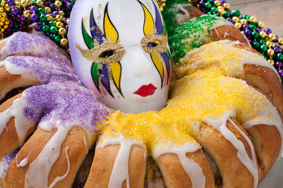 Finished king cake with purple, green, and gold sugars