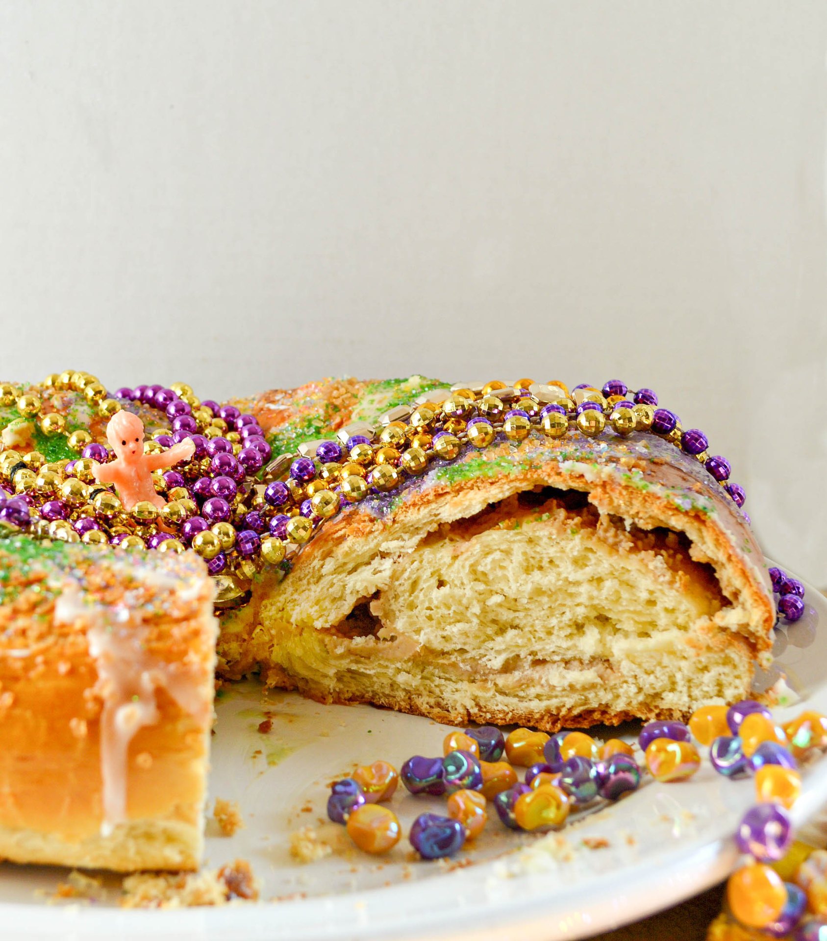 Sliced king cake showing the swirled filling