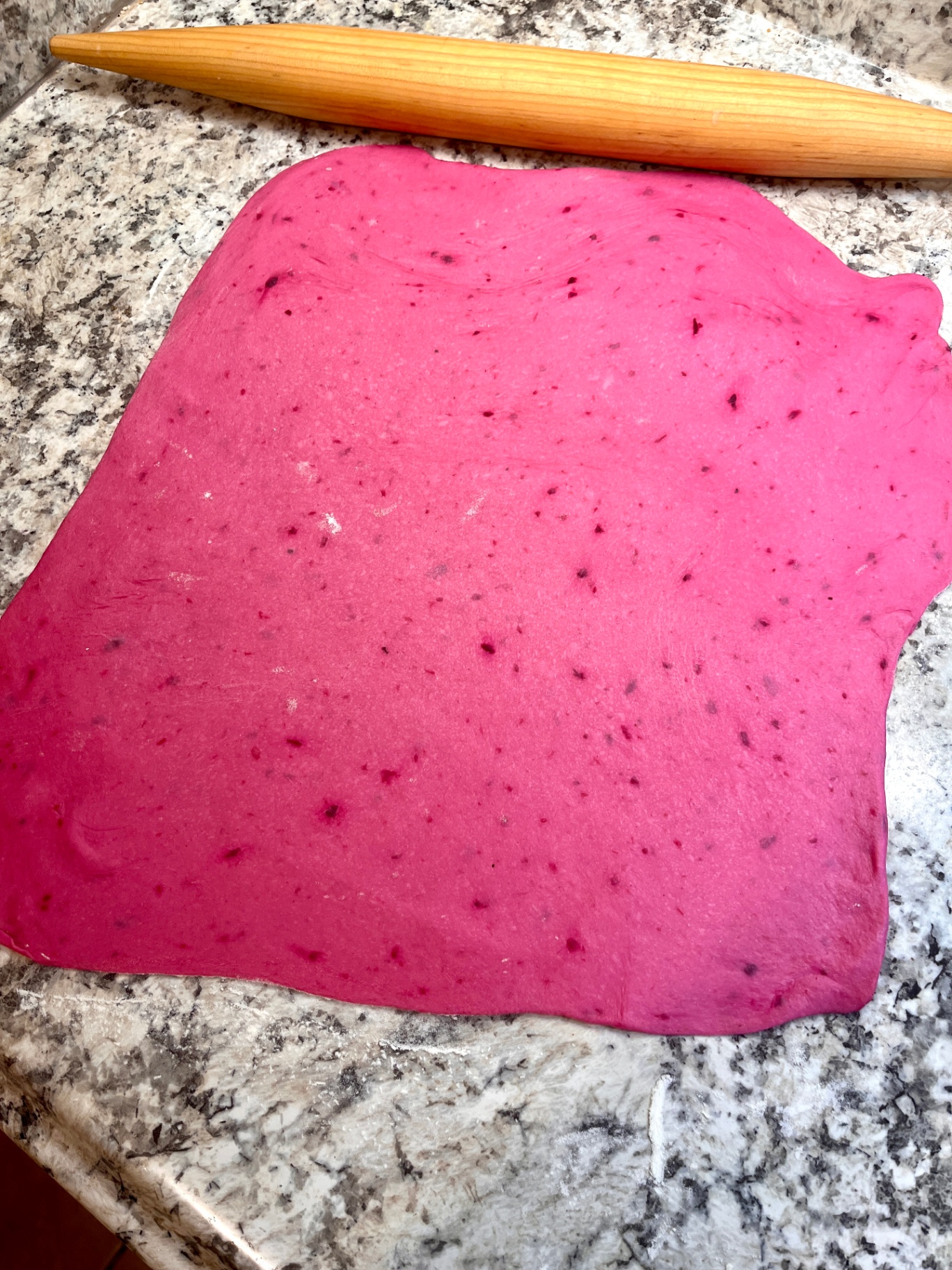 Pink beetroot dough rolled out for lamination